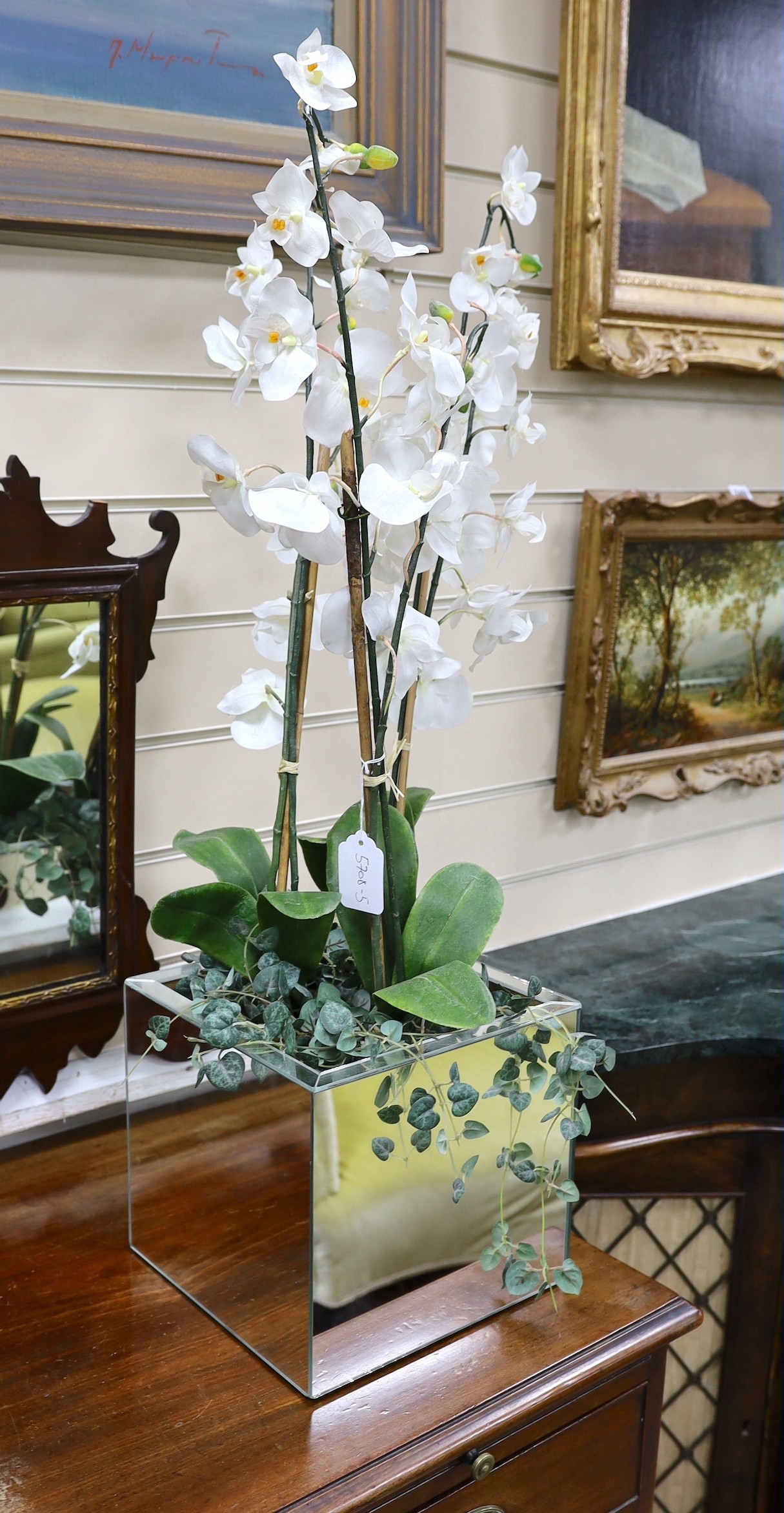 A display of tall white silk orchids in mirrored planter, approx 82cm